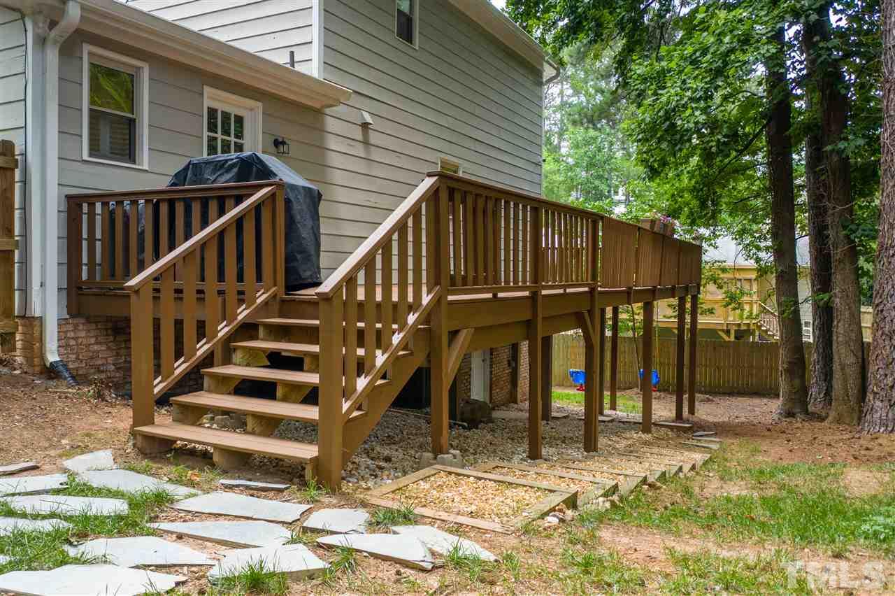 2104 Chrisdale Court Raleigh, NC 27607 - Photo 26 of 29 a view of a house with backyard and deck