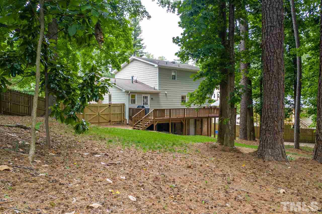 2104 Chrisdale Court Raleigh, NC 27607 - Photo 27 of 29 a view of a house with a backyard