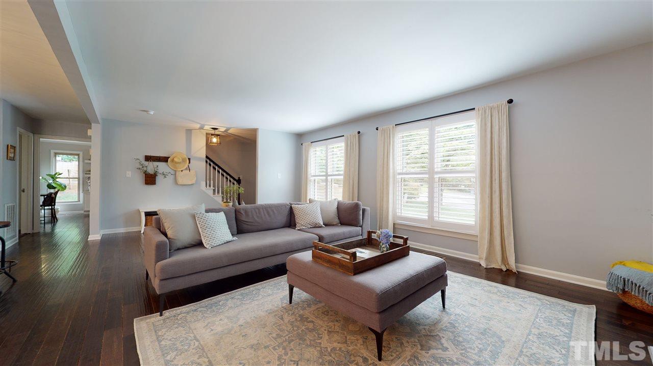 2104 Chrisdale Court Raleigh, NC 27607 - Photo 5 of 29 a living room with furniture and a window