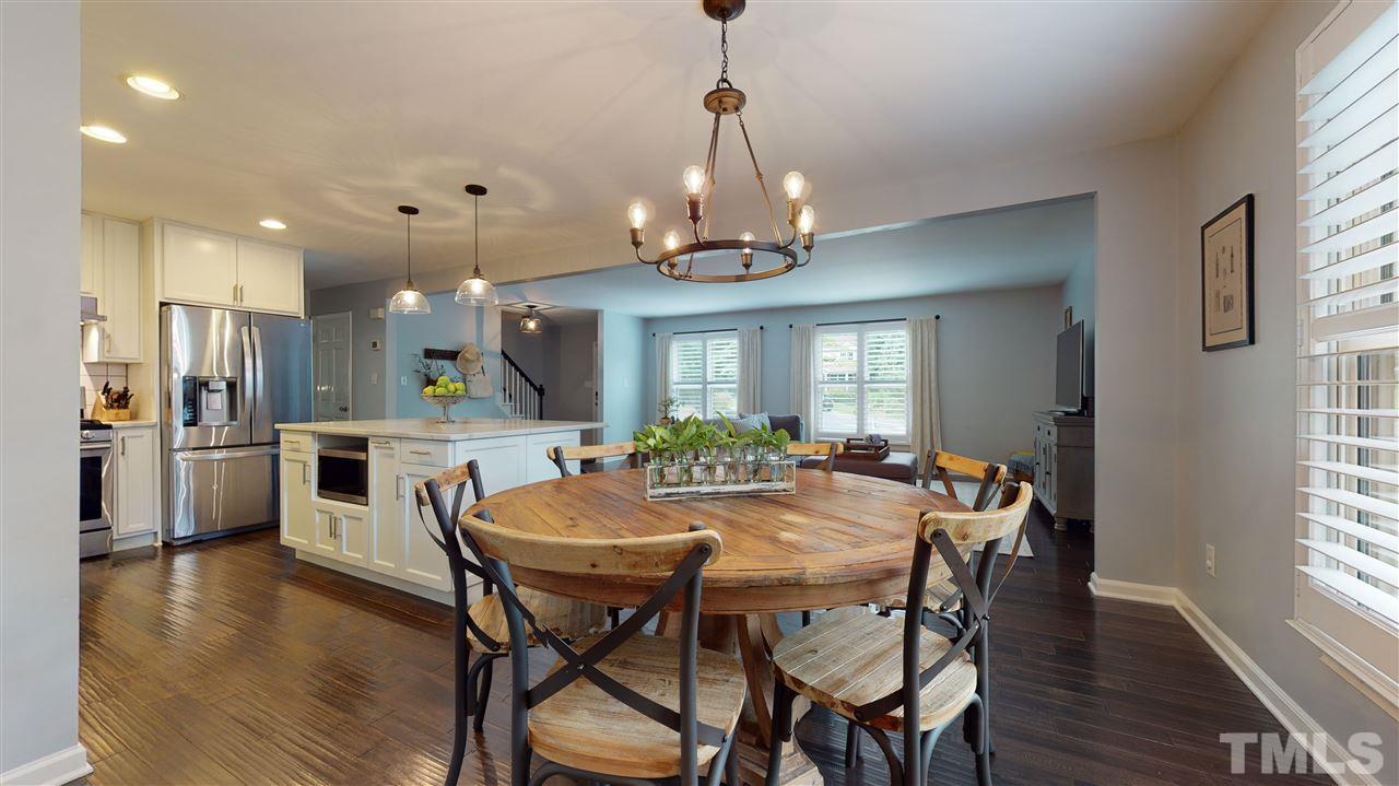 2104 Chrisdale Court Raleigh, NC 27607 - Photo 8 of 29 a view of a dining room with furniture window and wooden floor