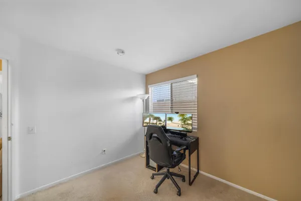 a view of a house with backyard and porch