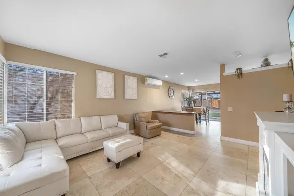 a kitchen with stainless steel appliances granite countertop a refrigerator sink and stove