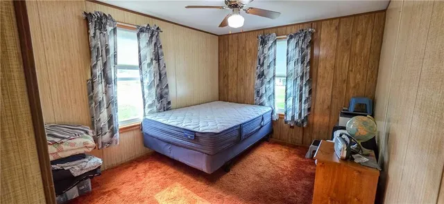 a bedroom with furniture and a window