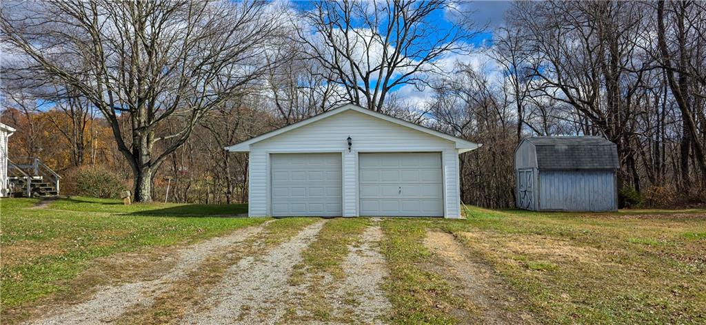 76 South Kings Creek Road Burgettstown, PA 15021 - Photo 15 of 15 a view of a house with a yard and large tree