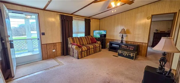 a livingroom with furniture and a flat screen tv