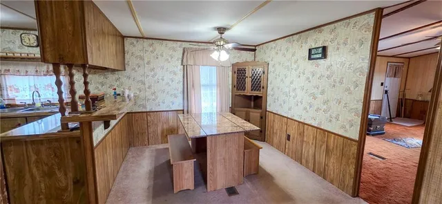a view of a kitchen and an entryway