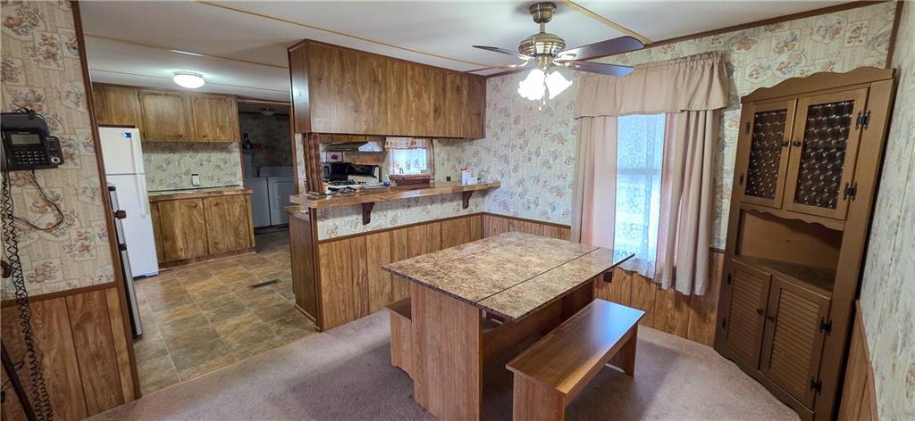 76 South Kings Creek Road Burgettstown, PA 15021 - Photo 7 of 15 a kitchen with refrigerator and cabinets