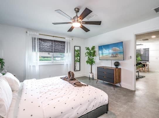 2747 Griffin Road, Unit 13 Fort Lauderdale, FL 33312 - Photo 13 of 37 a bedroom with a large bed and a large window