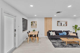 2747 Griffin Road, Unit 13 Fort Lauderdale, FL 33312 - Photo 18 of 37 a living room with furniture and wooden floor