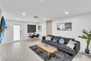 2747 Griffin Road, Unit 13 Fort Lauderdale, FL 33312 - Photo 22 of 37 a living room with furniture and wooden floor