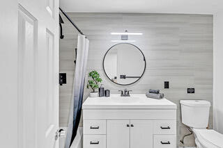 2747 Griffin Road, Unit 13 Fort Lauderdale, FL 33312 - Photo 24 of 37 a bathroom with a sink and a mirror