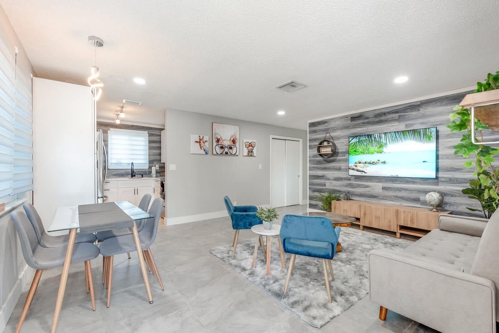 2747 Griffin Road, Unit 13 Fort Lauderdale, FL 33312 - Photo 32 of 37 a living room with furniture and a flat screen tv