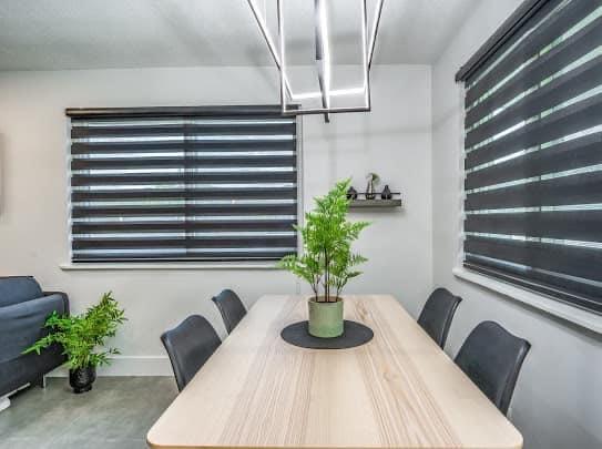 2747 Griffin Road, Unit 13 Fort Lauderdale, FL 33312 - Photo 5 of 37 a view of a dining room with furniture and a potted plant