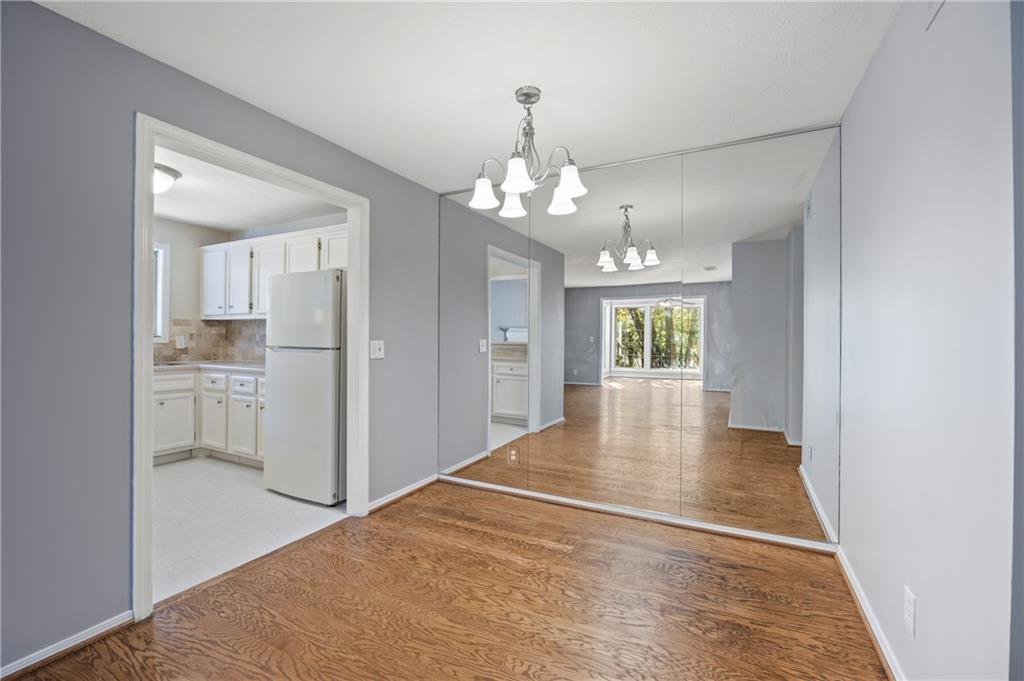 707 Gettysburg Place Atlanta, GA 30350 - Photo 15 of 40 a view of an empty room with kitchen and window