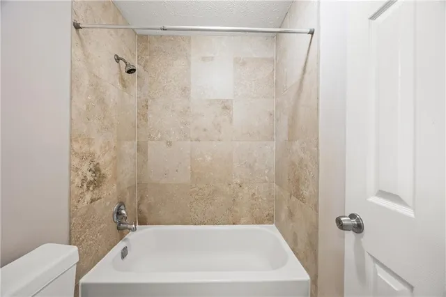 a bathroom with a white bath tub