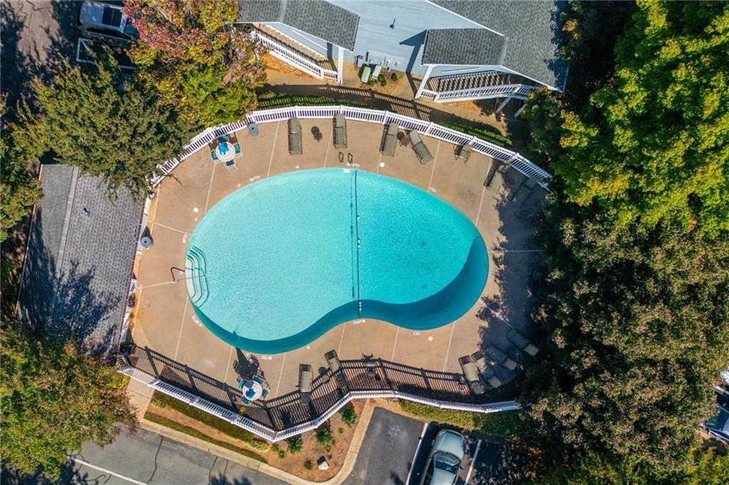 707 Gettysburg Place Atlanta, GA 30350 - Photo 33 of 40 an aerial view of a house with swimming pool and large trees