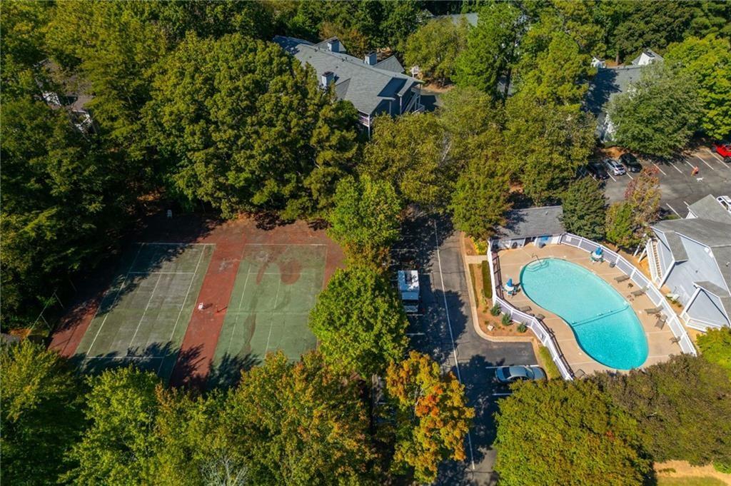 707 Gettysburg Place Atlanta, GA 30350 - Photo 34 of 40 an aerial view of a house with a yard and trees all around