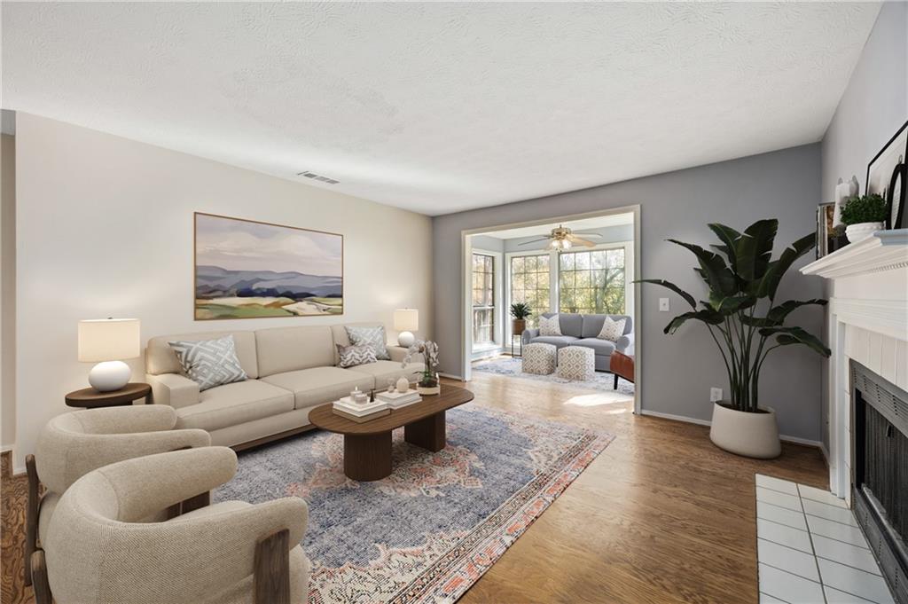 707 Gettysburg Place Atlanta, GA 30350 - Photo 4 of 40 a living room with furniture potted plant and a window