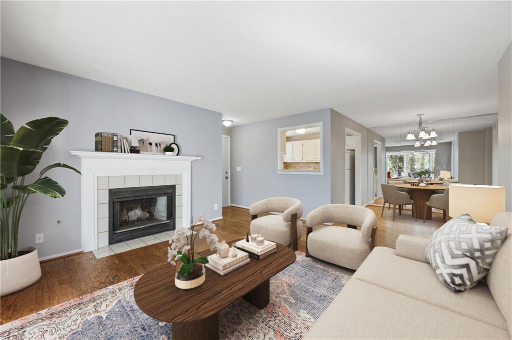 707 Gettysburg Place Atlanta, GA 30350 - Photo 7 of 40 a living room with furniture and a fireplace