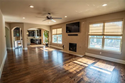 a view of livingroom with fireplace wooden floor and window
