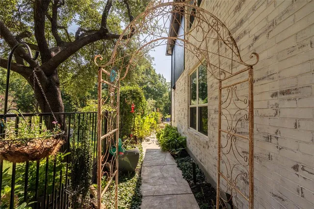 a view of a pathway both side of house