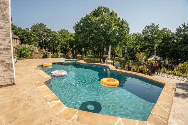 swimming pool with chairs
