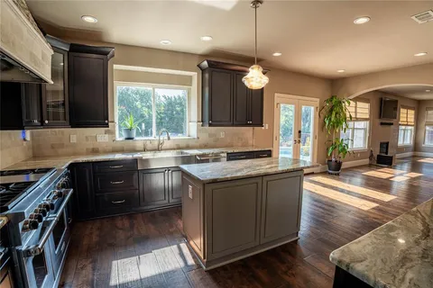 a kitchen with a stove and a sink