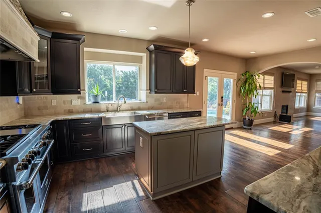 a kitchen with a stove and a sink