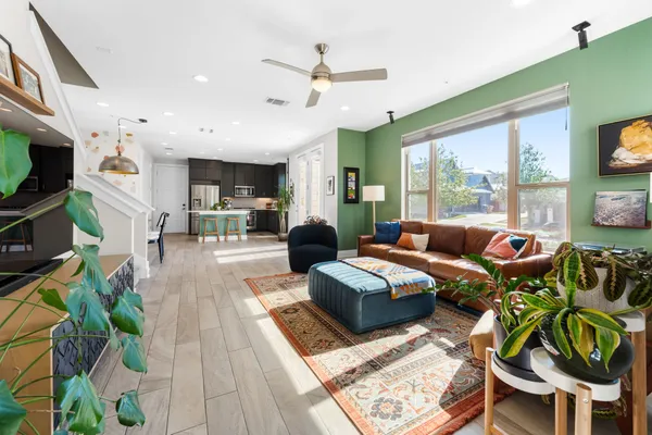 a living room with fireplace furniture and a flat screen tv