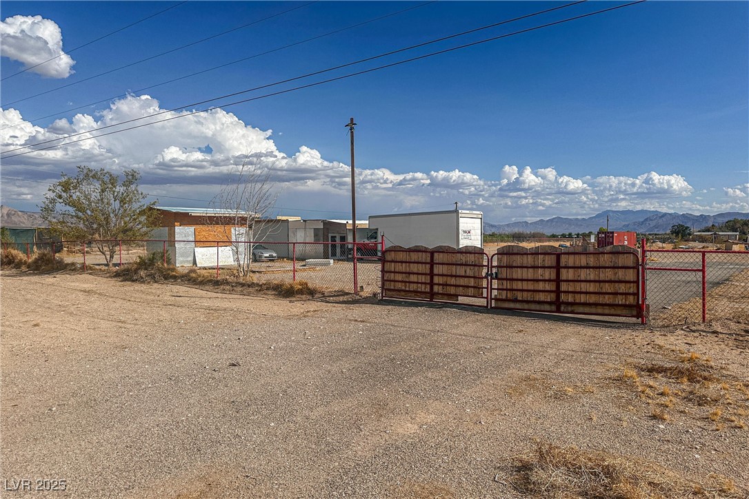 Fenced front yard with a gate