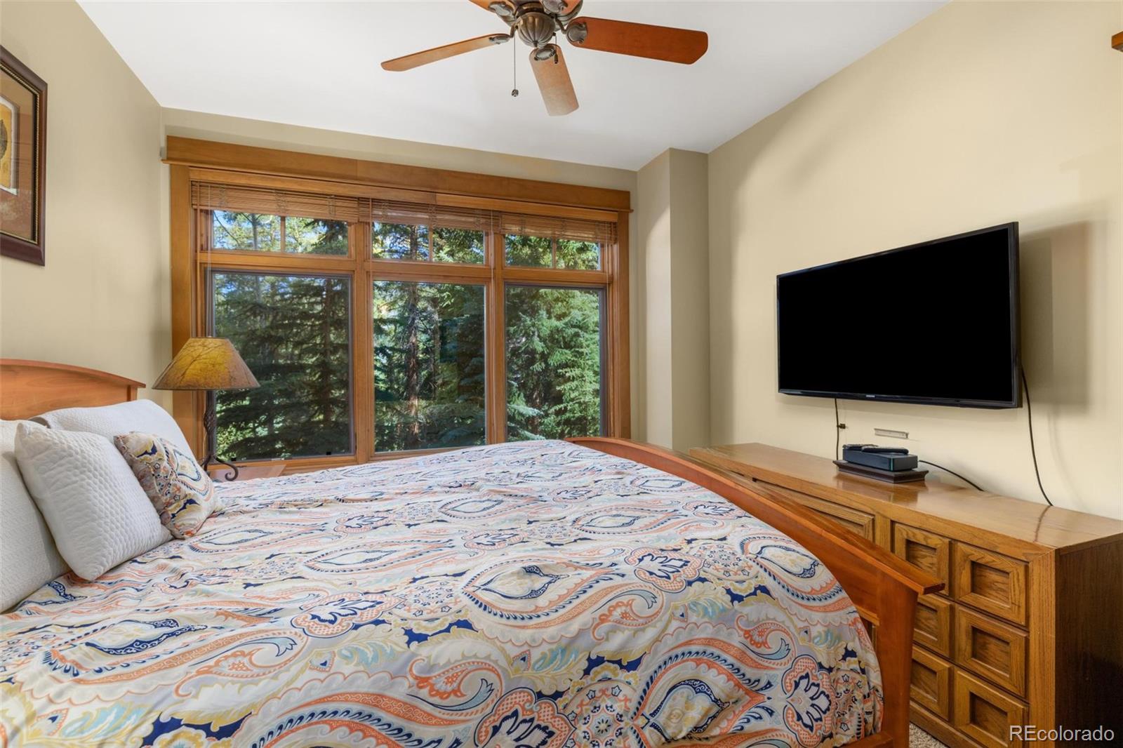 280 Trailhead Drive, Unit 3003 Dillon, CO 80435 - Photo 14 of 27 a bedroom with a bed and a flat screen tv