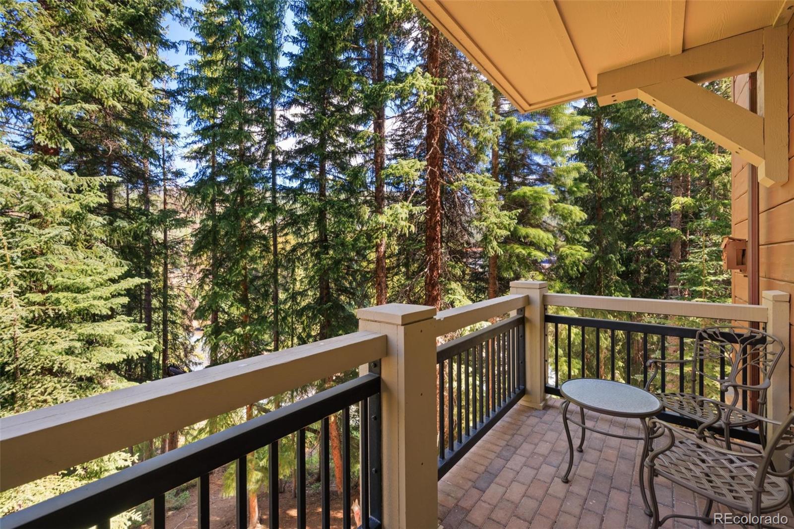 280 Trailhead Drive, Unit 3003 Dillon, CO 80435 - Photo 2 of 27 a view of a balcony with wooden fence and floor