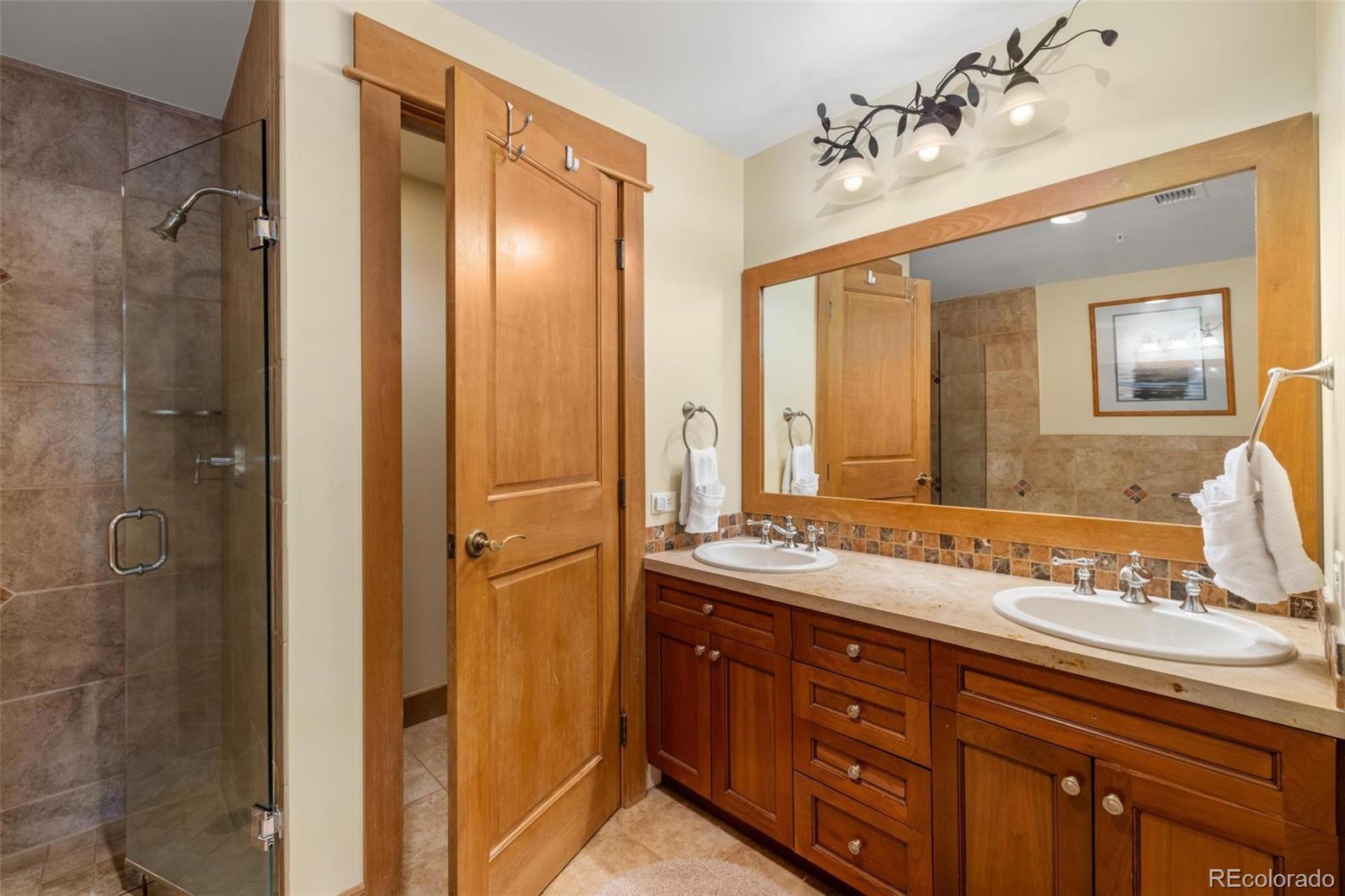 280 Trailhead Drive, Unit 3003 Dillon, CO 80435 - Photo 25 of 27 a bathroom with a double vanity sink mirror and double