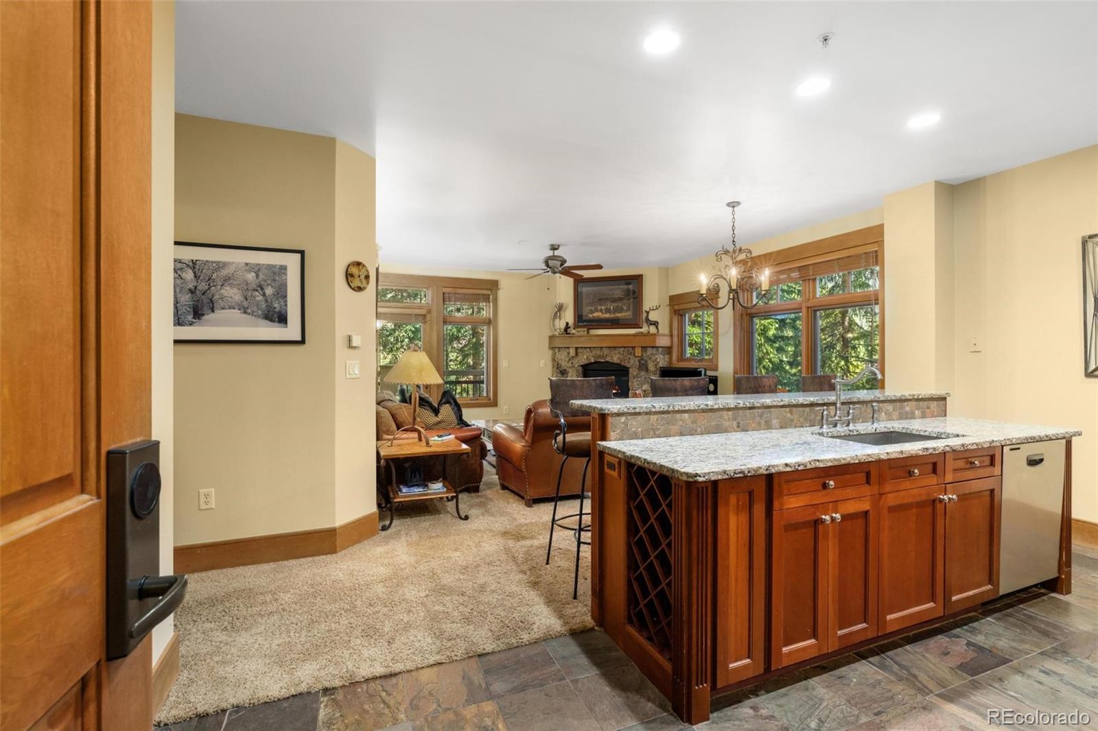 280 Trailhead Drive, Unit 3003 Dillon, CO 80435 - Photo 9 of 27 a kitchen with a stove and a refrigerator