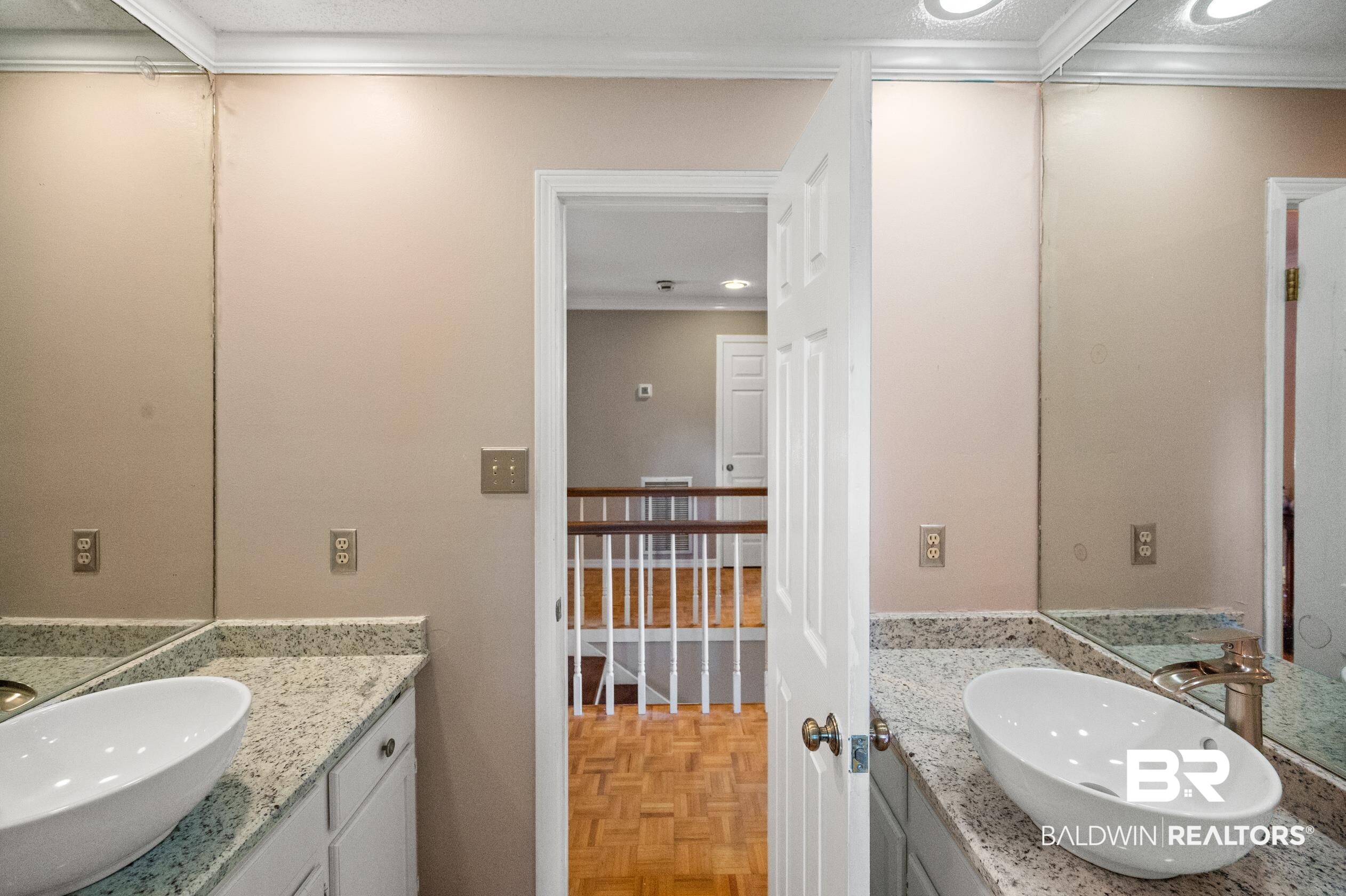 6705 Ridgeland Road South Mobile, AL 36695 - Photo 29 of 44 Bathroom with vanity, crown molding, parquet floors, and a textured ceiling