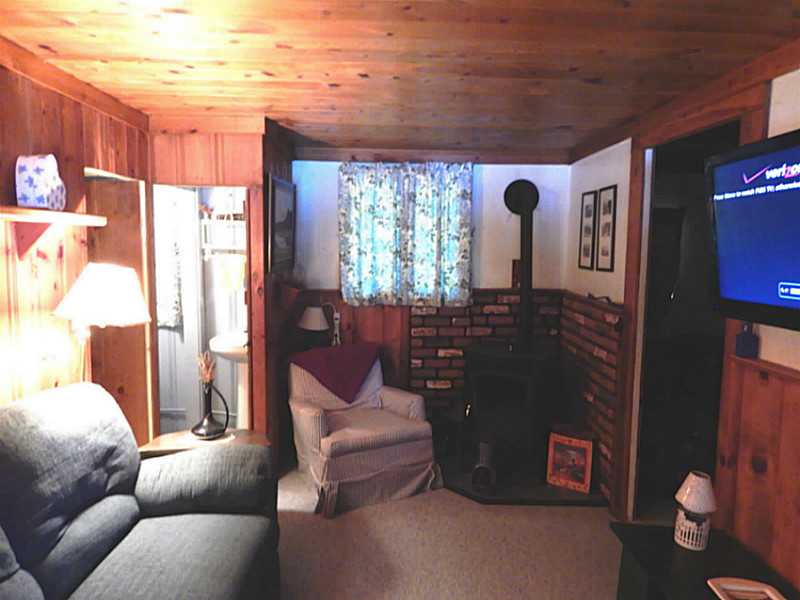 91 Pine Ledge Road, Unit 4 Glocester, RI 02857 - Photo 9 of 15 Living Room. This summer cottage can be changed to a all season home.