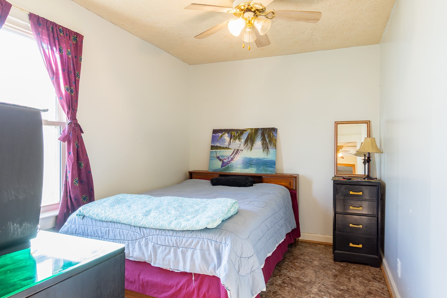 1140 Oak Grove Road Dickson, TN 37055 - Photo 14 of 19 a bedroom with a bed and a chandelier