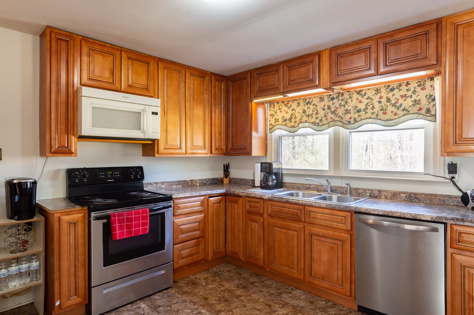 1140 Oak Grove Road Dickson, TN 37055 - Photo 8 of 19 a kitchen with granite countertop a sink stove top oven and cabinets