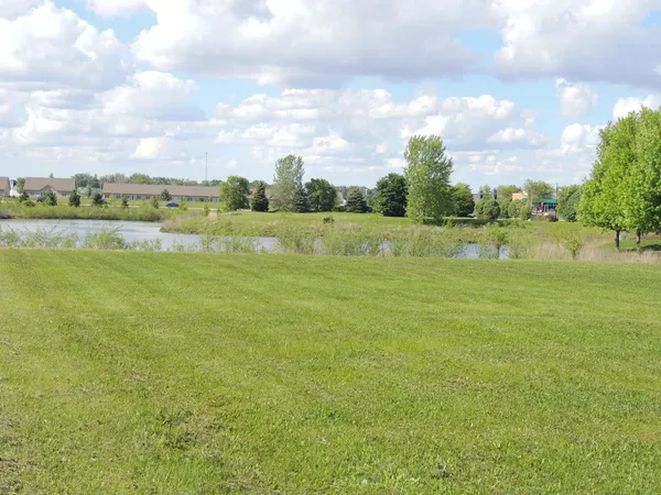 a view of an house with a yard