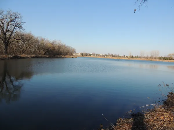 a view of lake with green space