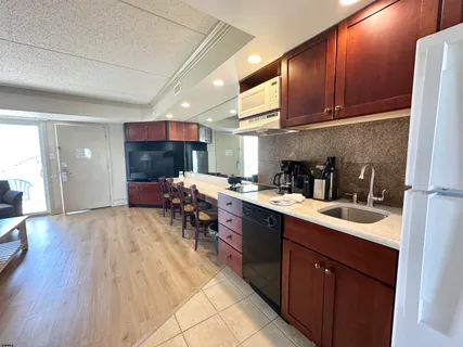 a spacious bedroom with two beds and a large window