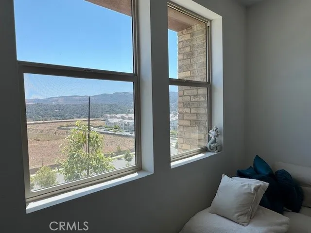 a kitchen with granite countertop white cabinets and a sink