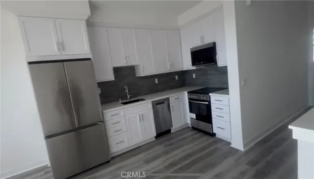 a bathroom with a shower toilet and sink