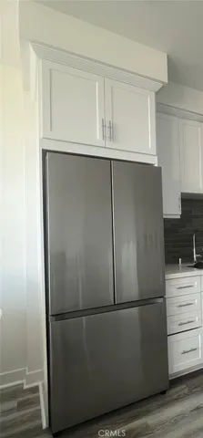 a bathroom with a sink mirror vanity and toilet