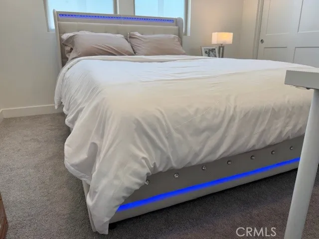 a swimming pool with outdoor seating and yard