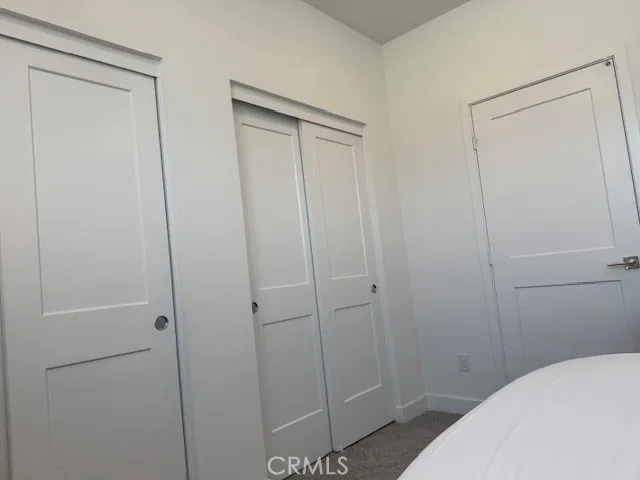 a view of a water pond with green field