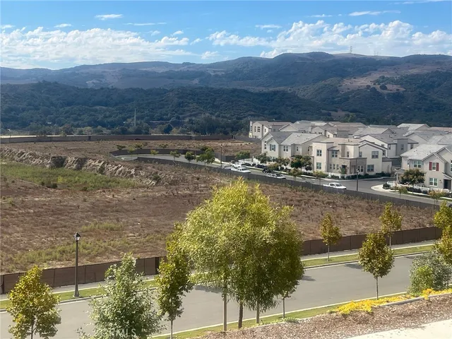 a white toilet sitting next to a white sink