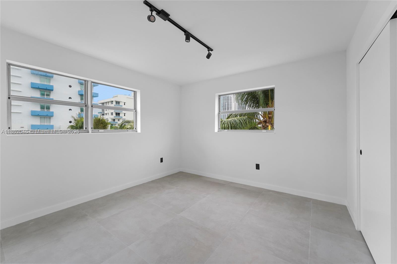 240 Collins Avenue, Unit 4A Miami Beach, FL 33139 - Photo 13 of 16 a view of room with window and ceiling fan
