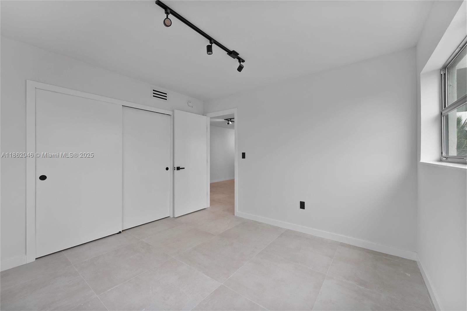 240 Collins Avenue, Unit 4A Miami Beach, FL 33139 - Photo 14 of 16 a view of an empty room