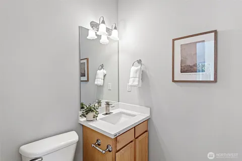a bathroom with a sink vanity and a mirror